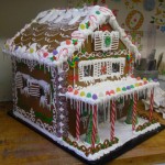 Gingerbread-house-with-candy-cane-pourch-and-sweet-candy-roof